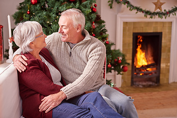 Image showing Senior couple, christmas and relax on sofa together for romance, love or festive holiday celebration in home. Elderly man, woman and happy quality time on couch to celebrate with christmas tree