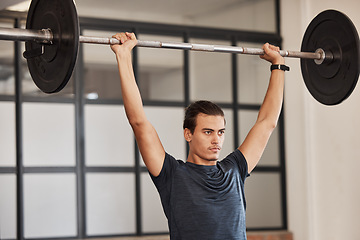 Image showing Strong man, overhead barbell and gym exercise, workout and fitness training in sports club. Young man, focus bodybuilder and power press, weightlifting challenge and muscle, motivation and energy
