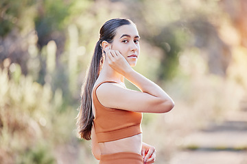 Image showing Fitness portrait, earphones and woman in nature streaming podcast, radio or motivation music for running. Sports, healthcare and female from Canada listening to audio and getting ready for training.