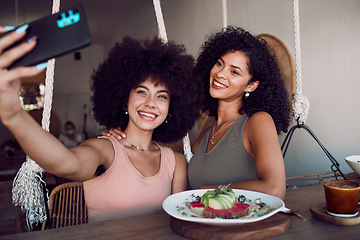 Image showing Black women, friends and phone selfie at restaurant, cafe or small business for social media. Relax, tech and females on wifi taking picture with mobile smartphone for happy memory or internet post.