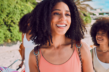 Image showing Black woman, friends and walking outdoor to travel with a backpack, happiness and fun in city on their vacation in summer. Afro women together for adventure, hangout and holiday at a tourist location