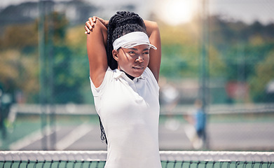 Image showing Fitness, tennis and stretching woman with focus, motivation and exercise wellness for sports competition, event or training. Black woman athlete in tennis court warm up workout for performance energy