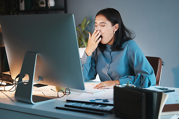 Image showing Burnout, tired and business woman yawn in office working on computer for planning, research or marketing idea at night. Overwork, employee or sleepy girl with strain, insomnia or low energy at desk