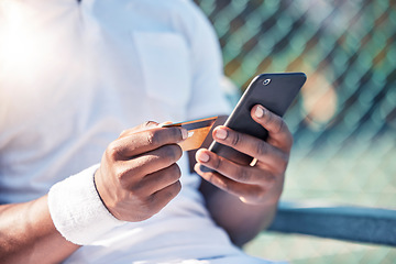 Image showing Credit card, phone and online shopping with a sports man making a payment online while sitting at a court. Finance, ecommerce and retail with a male athlete buying or browsing the internet outdoor