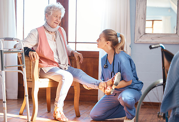 Image showing Senior woman, rehabilitation and help for foot injury, disability or pain in nursing home. Physiotherapist, doctor and treatment for feet, ankle or legs with physical therapy, elderly care and nurse