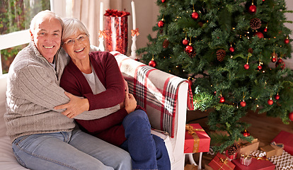 Image showing Christmas, senior couple and couch for happiness, festive season or relax together at home. Xmas, love and elderly woman with mature man, smile or bonding for love, content and on sofa in living room