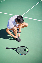 Image showing Tennis, tie and man with shoes on a court for sports training, fitness exercise or cardio workout in summer in Spain. Wellness, athlete or tennis player ready to start playing a game on tennis court