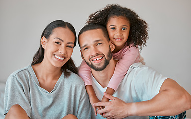 Image showing Family, children and love with a girl, woman and man on a sofa in the living room of their home together. Kids, happy and smile with a mother, father and daughter bonding in a domestic house