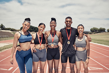 Image showing Portrait, diversity and team for sports winner, for competition and group smile together outdoor. Teamwork, fitness training and medals for games, success and victory for embrace, happy and on track.