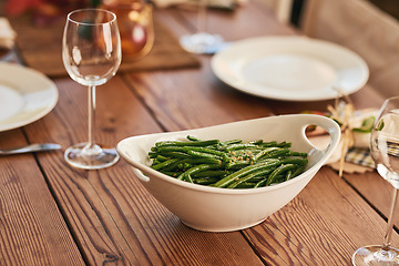 Image showing Table, vegetables and food for dinner, lunch and celebration in home dining room, restaurant or apartment. Supper, vegetable plate and wine glass for party, healthy meal and fine dining for holiday