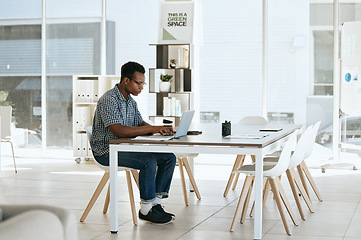 Image showing Creative, designer and laptop in web design or online marketing, advertising or development at the office. Black man employee working on computer in design for corporate company at the workplace