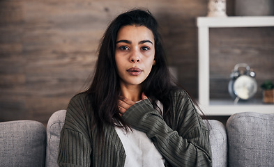 Image showing Anxiety, worry and woman breathing on sofa to relax, calm down and stress relief from panic attack. Mental health, depression and portrait of anxious girl sitting on couch with hand on chest in pain