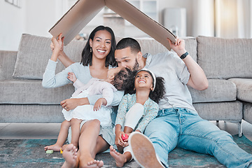 Image showing Happy family, cardboard roof or house life insurance in home living room floor in security, mortgage loan success or investment support. Property cover for smile, happy mother or father and children