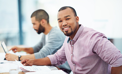 Image showing Businessman, documents and smile at desk with coworker in financial planning, analysis and strategy. Black man, happy and finance data on paper at desk for budget, teamwork or corporate partnership