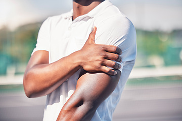 Image showing Black man, hand and arm pain from healthcare accident or medical wellness emergency outdoor. African person, shoulder injury and broken bone, hurt muscle or arthritis during fitness workout on court