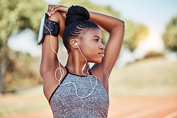 Image showing Exercise, fitness and black woman listening to music with earphones while stretching outdoor for exercise, workout and running. Female in nature for cardio with podcast for performance motivation