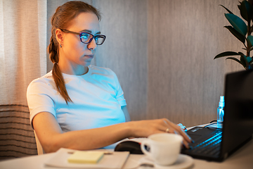 Image showing Woman in quarantine for coronavirus working from home