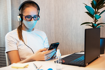 Image showing Woman in quarantine for coronavirus working from home