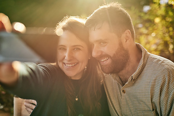 Image showing Phone, love and couple take a selfie for social media on a honeymoon date at a restaurant outdoors in summer. Smile, romance and happy woman enjoys taking photos with a romantic partner on holiday