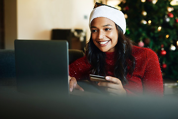 Image showing Credit card, laptop and Christmas woman online shopping, e commerce and fintech for home product marketing, advertising and promotion sale. Black woman on digital payment for house holiday decoration