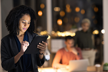 Image showing Tablet, night and deadline with a business black woman doing research on the internet while working overtime. Technology, search and strategy with a female employee late at work after hours