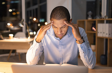 Image showing Stress, headache and laptop with businessman at night for deadline, overworked and burnout. Tired, fatigue and sleep with employee at desk for frustrated, mental health and productivity problem