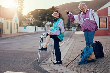 Image showing Hitchhiking, disability and travel with senior friends standing on a corner looking for a trip with a hand sign or gesture. Transport, road and handicap with a mature woman and friend hitching a ride