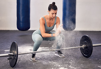 Image showing Woman, bodybuilder and powder in gym for barbell on hands for, safety, wellness and fitness. Girl, deadlift and weightlifting for workout, crossfit and strong body with power, muscle and healthy