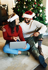 Image showing Christmas, credit card and couple online shopping, laptop and living room, lounge and house for gifts, presents and holiday sales. Happy man, smile woman and ecommerce, festive xmas buying on website