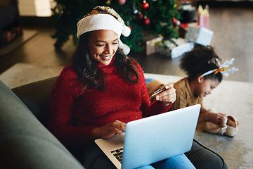 Image showing Christmas online shopping, e commerce and woman with credit card and laptop for internet and payment online. Holiday retail sale, family and ecommerce with mother buying and child playing on floor.