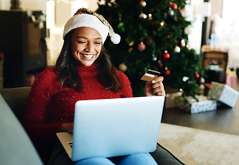 Image showing Credit card, laptop and woman online shopping on Christmas day in living room. Fintech, xmas holiday and happy female from India on computer, virtual store or internet shop buying gifts or presents.