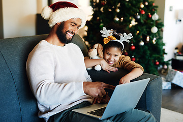 Image showing Christmas, black dad and daughter with laptop on sofa on internet, reading social media and smile. Holiday, father and girl with pc, happy and bonding on couch in family home, living room and web app