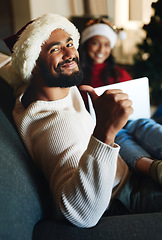 Image showing Portrait, home and man with thumbs up on Christmas in celebration of a Christian holiday with wife at home. Love, smile and happy person enjoys a special family day on sofa in winter in New Zealand