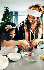 Image showing Black woman, girl and christmas baking in kitchen for learning, teaching and domestic skills in family home. Cooking, mother and daughter in house for holiday cookies, festive food and celebration