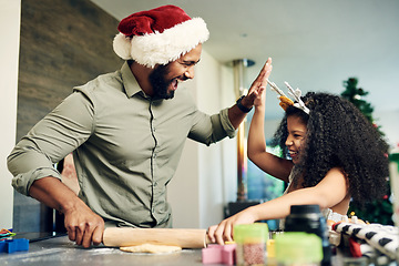 Image showing Christmas baking, father and girl high five, learning and success in kitchen with recipe or ingredients with happy smile. Family, bake and celebration, support and excited for xmas cookies on holiday