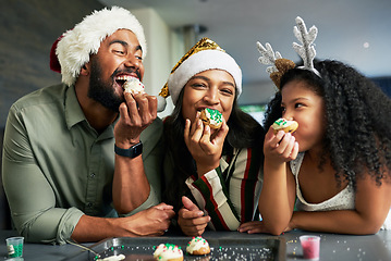 Image showing Family, christmas and eating cookies together after baking and cooking for bonding and learning. Bake, cook and sweet biscuit dessert with a mother, father and daughter enjoying food snack