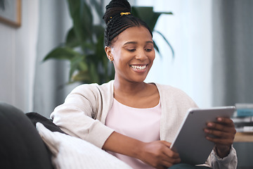 Image showing Black woman, happiness and tablet on sofa for communication, social media and online shopping or banking with home wifi connection. Female with technology for streaming, mobile app and social life