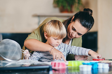 Image showing Mother, boy child and teaching baking in kitchen for learning, domestic skills or cookie in family home. Cooking, mama and son in house for education, cookies or food with love, care or development