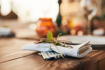 Image showing Closeup, dinner table and setting with a napkin and ties to celebrate with a festive meal or food. Holiday, dining table and dish for a dinner or lunch with an empty bokeh background with nobody