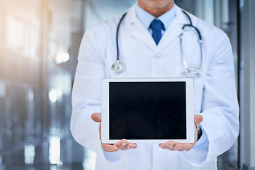 Image showing Tablet, screen and mockup with doctor in hospital for advertising, marketing or product placement. Medical professional, tech and digital touchscreen for telehealth, online consultation or research.