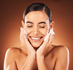 Image showing Foam, skincare and woman face for cosmetics cleaning, wellness and glow with smile in studio mockup. Happy, young and beauty girl or model with facial wash soap for dermatology skin care and benefits
