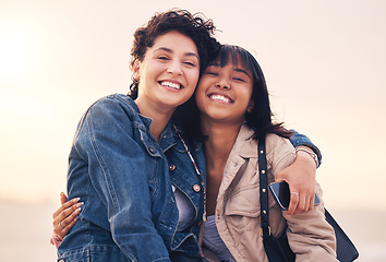 Image showing Hug, bonding and women at the beach, travel smile and freedom in summer by the ocean. Relax, happy and portrait of friends hugging with affection during holiday quality time by the sea in nature