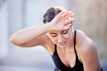 Image showing Fitness music, sweat and woman tired after outdoor running, cardio workout or marathon race training. Radio podcast, wellness and exhausted athlete runner with fatigue after sports performance action