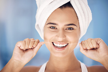 Image showing Face, dental and woman flossing teeth for oral health and hygiene. Portrait, tooth wellness and happy, healthy and young female from Canada with smile cleaning mouth for dental care in the morning