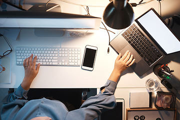 Image showing Business woman, computer and hands typing on keyboard above at night with laptop, PC and phone on office desk for software, coding and engineering. IT technician working on research and programming