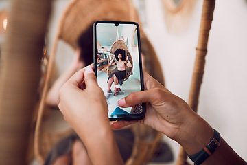 Image showing Hands, phone and fashion with a designer taking a photograph of a model black woman in a swing chair. Smartphone, photography and style with an edgy female on screen or display of a design employee