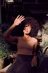 Image showing Sun, shadow and woman with cover in a garden, happy summer and hand for safety in nature. Spring, wellness and girl with security from the sunshine while gardening plants in a sustainable greenhouse