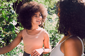 Image showing Park talking, black woman and friends gossip, communication and chat about nature beauty, agriculture or plant growth. Peace, freedom and African people in conversation, speaking or gen z discussion