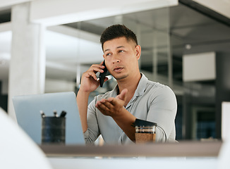 Image showing Phone call, laptop and explain with a business man talking or negotiating a deal using mobile communication. Computer, discussion and smartphone with a male employee working on negotiation in office