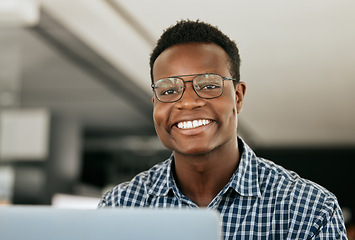 Image showing Portrait, laptop and it support with a black man working in his office as an engineer or technician. Face, happy and smile with a nerd or geek at work in information technology or internet security